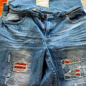 Cowgirl Tuff jeans with Independence patches. They are natural waist.